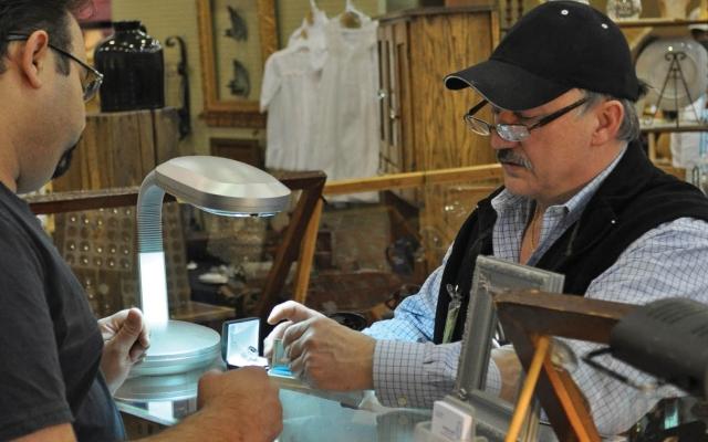 Antique seller and customer